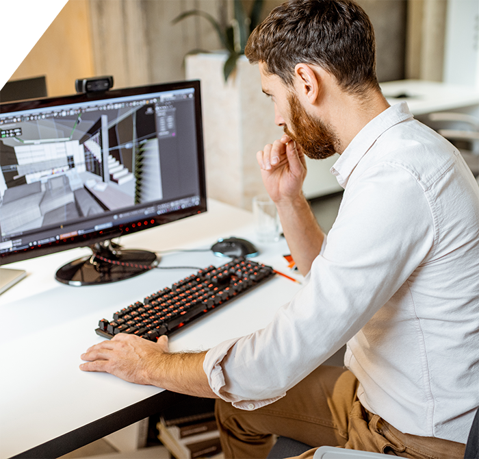 man looking at apartment renderings on a computer