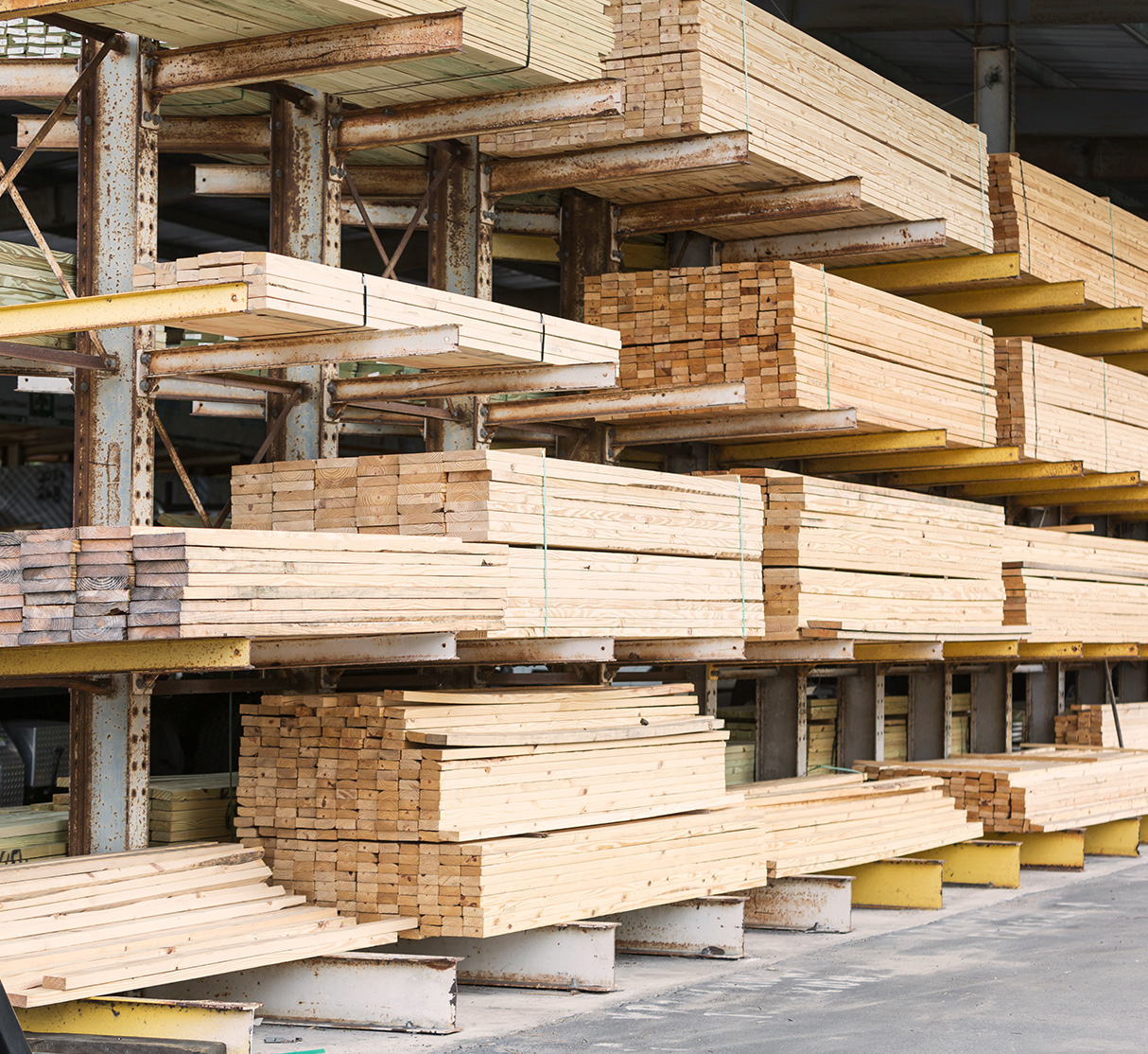 Photo of lumber stacked at lumber yard