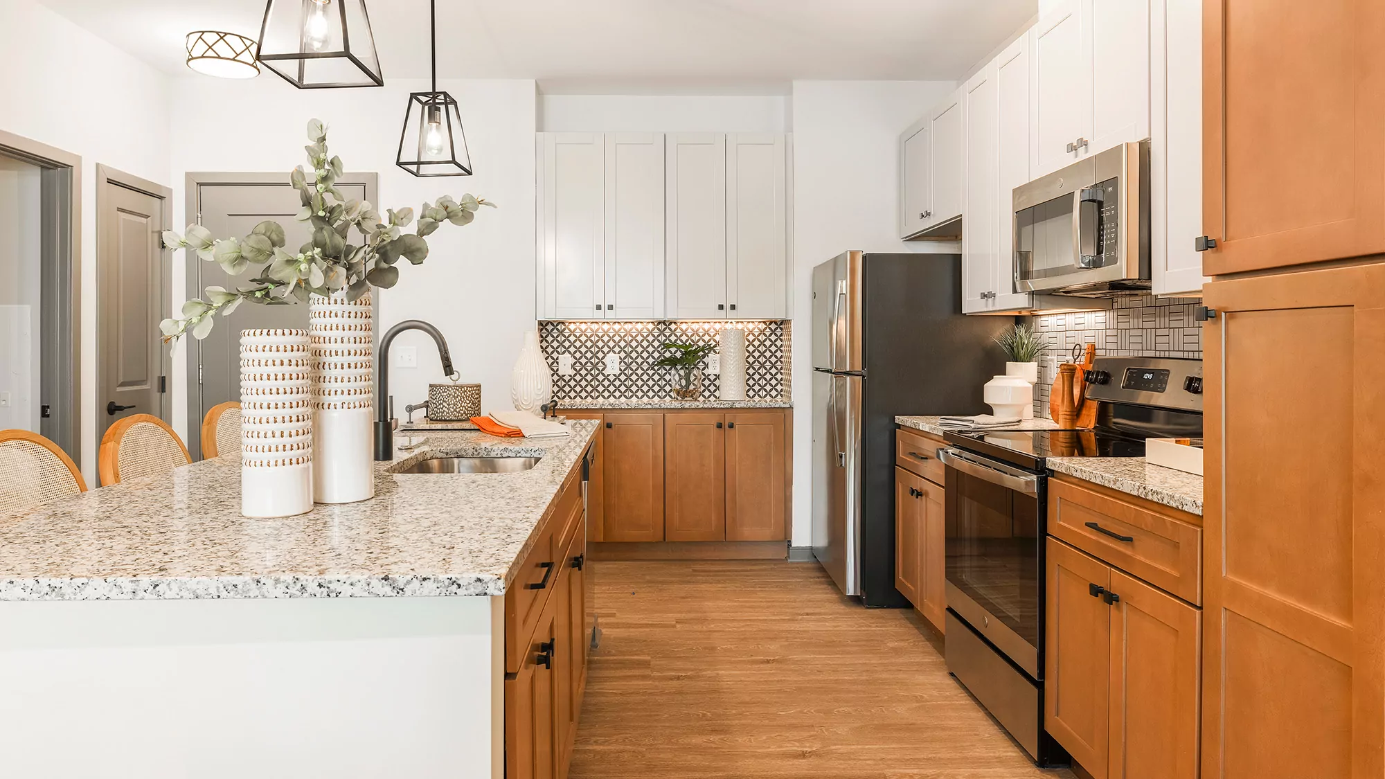 Kitchen with two tone color cabinetry