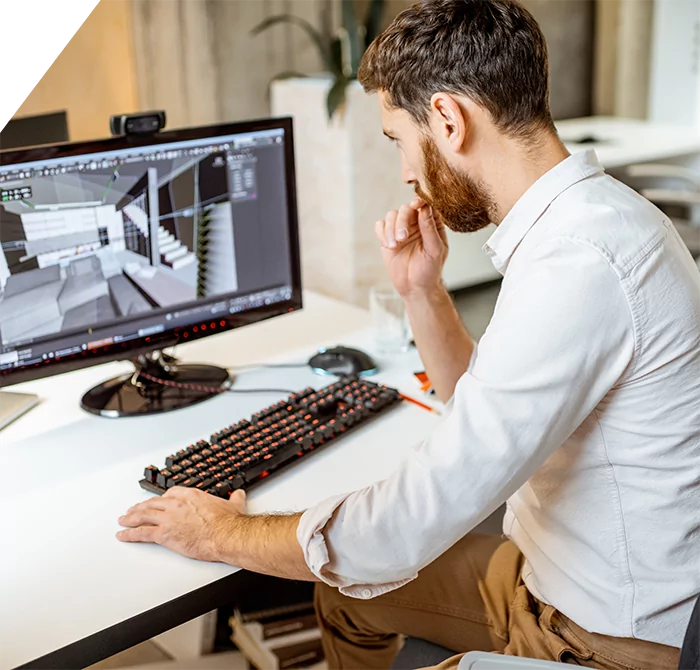 man looking at apartment renderings on a computer