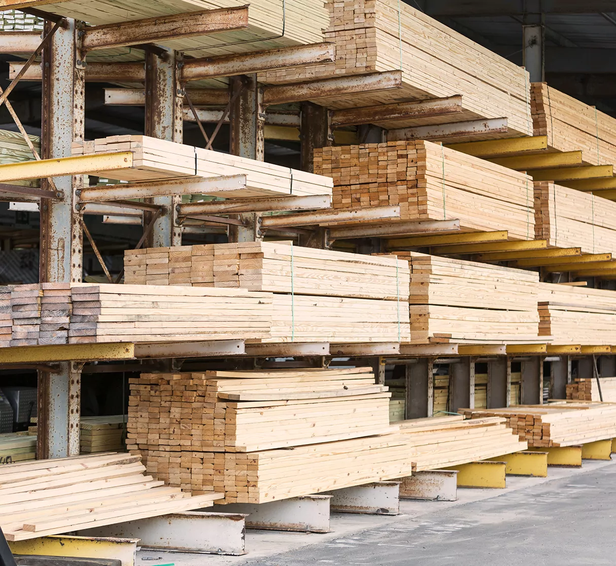 Photo of lumber stacked at lumber yard